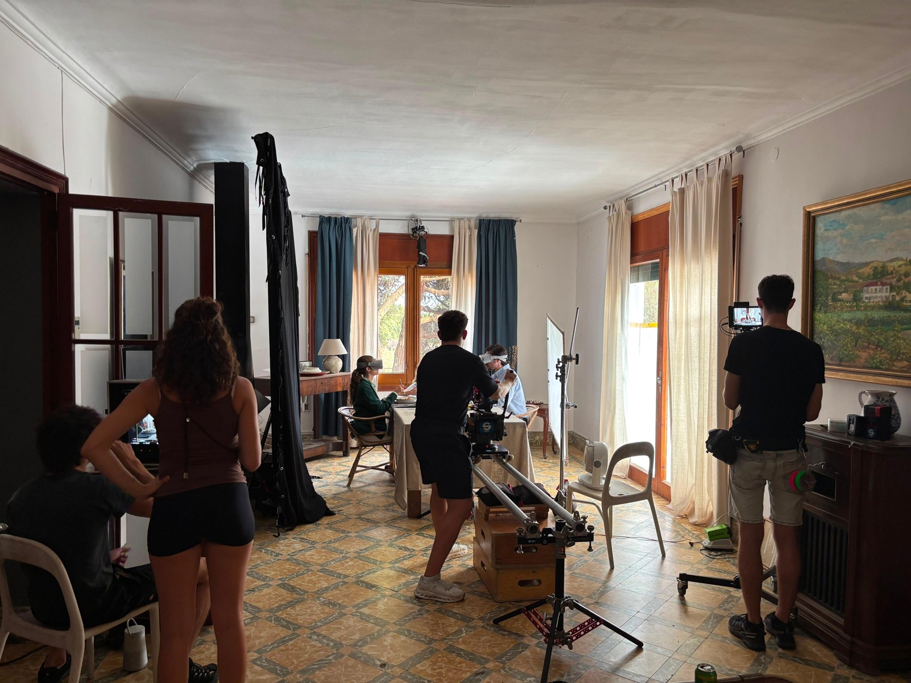 Wide view of the crew filming the dinner scene